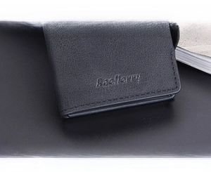 Detail shot of men's RFID card holder featuring textured leather and embossed logo