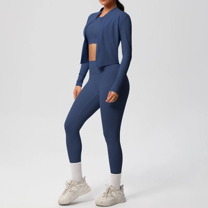Detail view of navy blue three-piece yoga set featuring a zip jacket and high-waist leggings