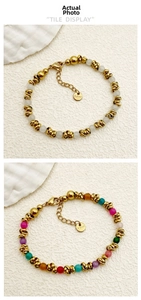 Detail of colorful beads and gold stainless steel chain bracelet with lobster clasp