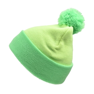 Detail of green ribbed knit beanie with two-tone design and fluffy pom-pom for winter