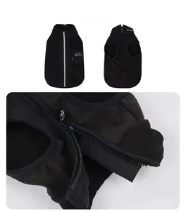Detail of dog vest showing protective zipper guard and warm black fleece fabric texture