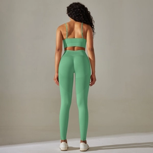 Detailed back view of seamless mint green ribbed yoga set with bra and high-waist leggings