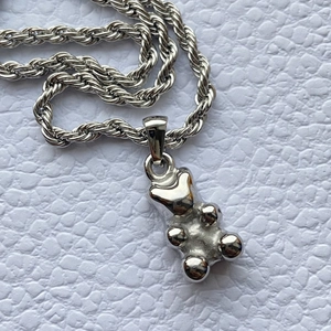 Polished silver stainless steel bear pendant necklace with a thick rope chain design