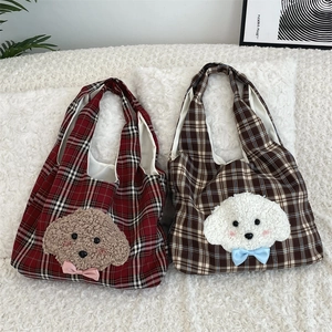 Close-up of cute plush puppy embroidery on plaid canvas tote bags with soft lining
