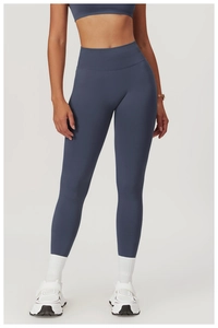 Detail of high-waisted seamless yoga pants and matching sports top in dusty blue