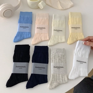Mid-calf cotton socks with bow and floral knit textures in various pastel colors