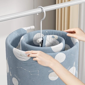 Spiral stainless steel laundry drying rack for bedsheets and quilts with space-saving design