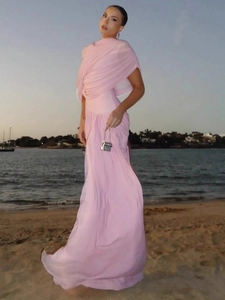 Elegant pink sleeveless maxi dress with a halter neckline for beach parties or events