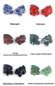 Detailed comparison of hand-carved stone crocodiles in jasper agate and obsidian textures