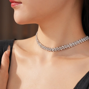 Close-up of sparkling rhinestone choker necklace on model with elegant silver finish