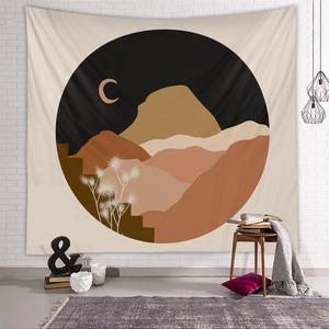 Detail of bohemian tapestry with abstract mountain scenery on a white brick wall