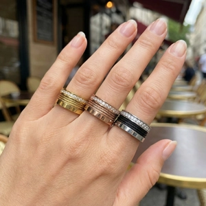 Close-up of three-piece set of cable rings with Roman numerals and wide crystal bands