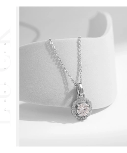 Detailed view of S925 silver halo necklace featuring a sparkling one carat round moissanite