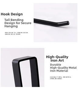 Close-up of black iron paper towel holder showing the sturdy hook and durable metal frame
