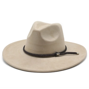 Detailed macro view of the beige fedora hat showing woven band and silver metal buckle