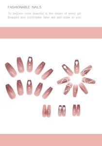 Detailed view of long ballerina press-on nails with pink gradient and rhinestones