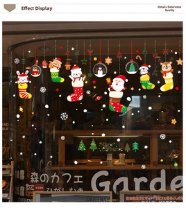 Festive Christmas window decals with cartoon animals and snowflakes on a cafe glass
