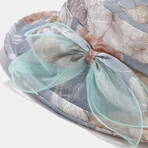Women's sun hat with floral embroidery and mint green organza bow detail for summer