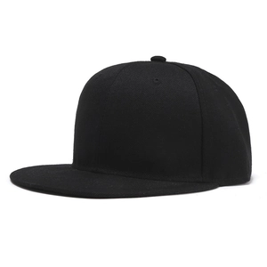 Detailed close-up of high-density black cotton twill texture on a flat brim snapback cap