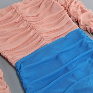 Detail of ruched mesh fabric in pink and blue colorblock style for a slim fit dress