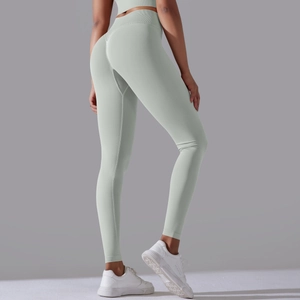 Detailed texture of high-waist seamless mint green yoga leggings for fitness training