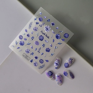 Macro view of 5D embossed purple flower nail art stickers with 3D texture on nails