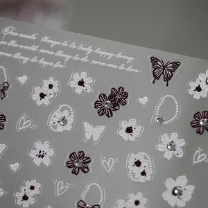 5D embossed nail stickers featuring white and purple flowers with butterfly designs