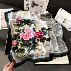 Detailed close-up of a pink peony ink painting print on a premium silk scarf