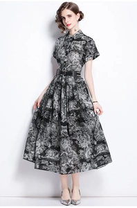 Detailed view of women's animal print dress featuring a lapel collar and matching black belt