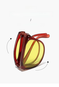 Detail view of foldable sunglasses showing red frame and compact 20g lightweight design