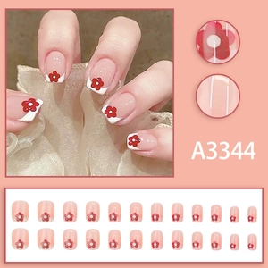 Pink sheer press-on nails with white French tips and red flower accents, 24-piece set