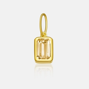 Detailed close-up of a gold s925 silver pendant with large yellow rectangular zircon
