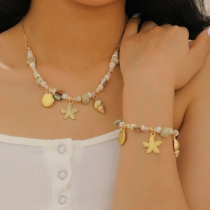 Set collana e bracciale con ciondolo a stella marina dorata, conchiglia e perline