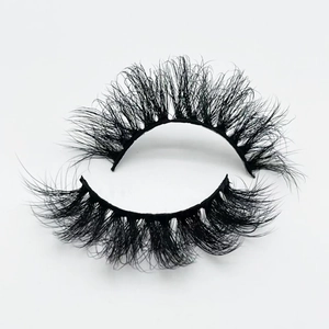 Detail of dense 20mm 3D fluffy faux mink eyelashes with natural curl on white background