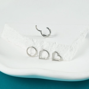 Silver stainless steel hinged segment rings in heart and round shapes on stone decor