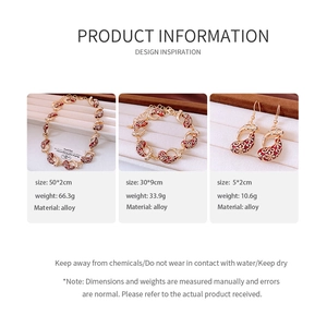 Detailed view of vintage gold alloy jewelry set with red enamel and floral patterns
