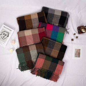 British style checkered scarves with tassels in multiple colors on a clean white background