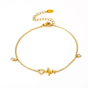 Gold stainless steel heartbeat anklet with zircon heart pendant on white background