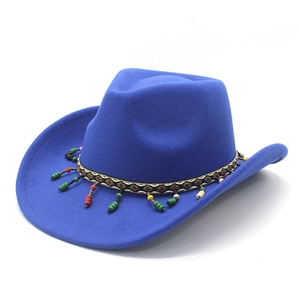 Close-up of royal blue wool cowboy hat with colorful ethnic beads and tassel hatband