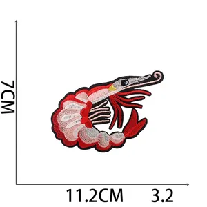 Detailed lobster marine life embroidery patch in red and pink colors for clothing