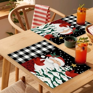Set of two Nordic Christmas placemats with Santa Claus and festive red bird pattern