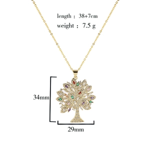 Close-up of gold plated tree of life pendant with colorful zircons and size specifications
