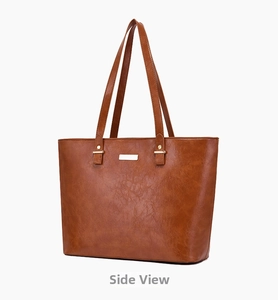Detailed side view of brown tote bag made of vintage textured PU leather with gold hardware