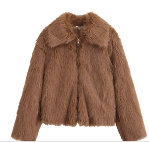 Detail view of brown plush jacket featuring a large lapel and metallic zipper closure