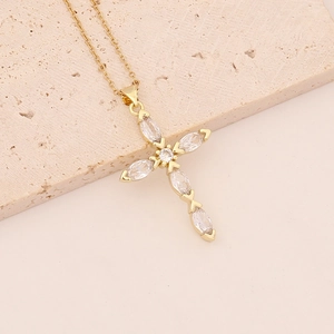 Iced out cross pendant necklace in gold-plated copper with clear cubic zirconia crystals