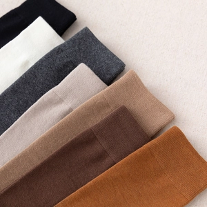 Women's solid color calf-high socks in multiple earth tones with ribbed cuffs