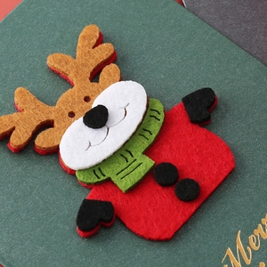 Green felt Christmas greeting card featuring 3D reindeer applique and Merry embroidery