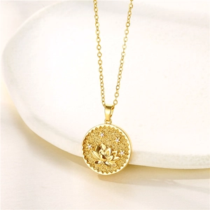 Close-up of gold stainless steel necklace featuring a lotus flower coin pendant with zircon