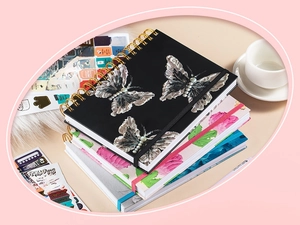 Detail of A5 spiral notebooks with 3D butterfly design and creative English stickers