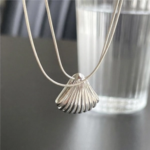 Minimalist 925 sterling silver necklace with a shell pendant on a snake bone chain